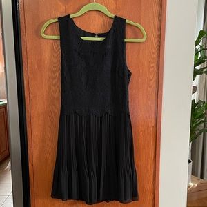 Little black dress with mixed textures in size small